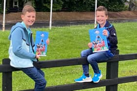 Evan and Leo were two of the first to get their hands on the Budget Energy SuperCupNI 2025 official programme at the Lodge Hotel in Coleraine. CREDIT SUPER CUP NI