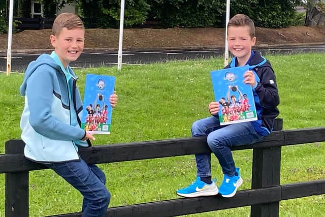Evan and Leo were two of the first to get their hands on the Budget Energy SuperCupNI 2025 official programme at the Lodge Hotel in Coleraine. CREDIT SUPER CUP NI