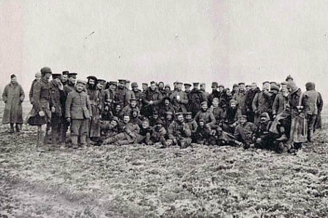Gordon Highlanders posing for the camera with German soldiers in No Man’s Land on Christmas Day 1914