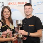 Pictured at the CITB NI SkillBuild NI Finals 2023 was Conor Dallas from Northern Regional College’s Ballymoney campus receiving the Overall Apprentice of the Year award from Sarah Travers, host and MC at the competition.