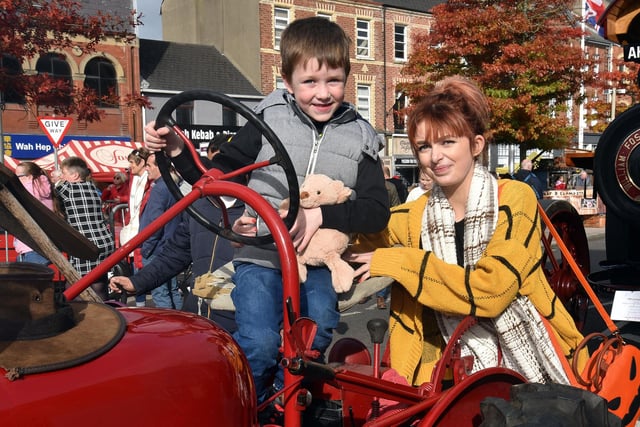 Taking the chance to sit on a vintage tractor on Saturday is Alfie Wright (7) with his mum, Lily Hynes. PT41-216.