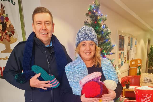 Salvation Army Major Scott Cunliffe and his wife Linda were delighted to accept over 500 items of hand-knitted clothing, blankets, hats, gloves and children’s toys made by young offenders and female prisoners at Hydebank Wood College to be distributed to less fortunate by the Salvation Army this Christmas. Pic credit: DOJ