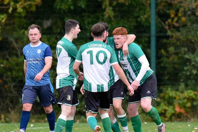 Lisdrum's Paul Cunningham, pictured being congratulated by his teammates after scoring a goal during the league, also netted on Saturday as his side progressed in the AOH Cup beating Millburn Utd 3-2.