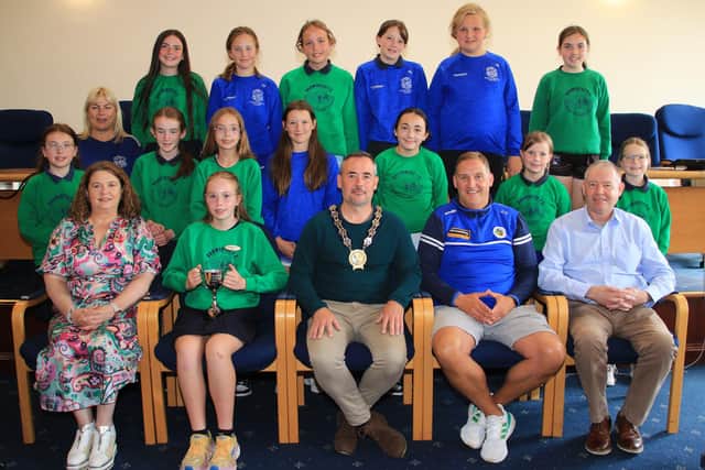 Dromintee Primary School Girls Team Won the Malachy McGeeney Cup in the Medium Schools Competition in the Athletic Grounds in Armagh. Team pictured with front row l-r Principal Wendy McKeown, Team Captain Niamh Harris, Chairperson Newry, Mourne and Down Council, Councillor Philip Campbell, Oliver Gaughran Volunteer/parent/coach and Councillor Mickey Larkin.