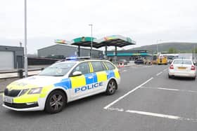 Fire investigation officers and PSNI at Boucher Crescent in Belfast following a fire at a filling station in the area. Picture: Pacemaker