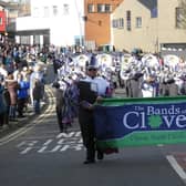 The Clover Band passes along High Street.