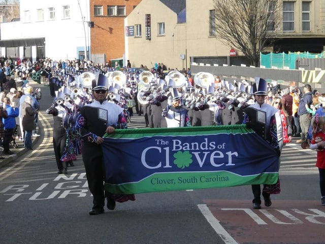The Clover Band passes along High Street.