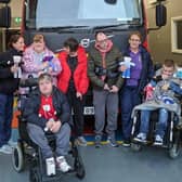 Visitors from Larne Adult Centre deliver some of the teddies with Michelle and Warren Logan.  Photo: Carrickfergus Fire Station