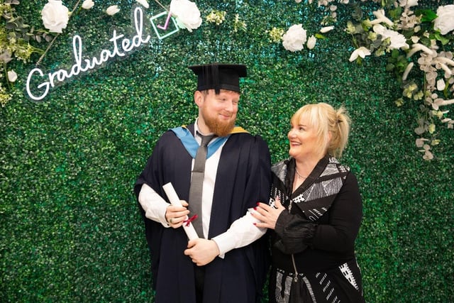 South West College (SWC) Dungannon campus graduate Luc Roberts, with his mum celebrating his achievements on the Open University BSc (Hons) Computing Science.