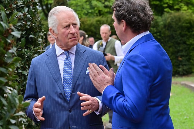 King Charles learns more about the coronation garden at Hazelbank Park, designed by Diarmuid Gavin. Picture: Colm Lenaghan/Pacemaker
