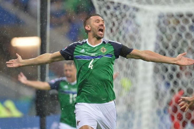 Larne native Gareth McAuley holds a special place in Northern Irish football history as the first player to score a goal at a Euros finals when he found the net against Ukraine in 2016. Starting his career in the Irish League in 1999 with Linfield, before spells at Ballyclare Comrades, Crusaders and Coleraine, McAuley made the move to Lincoln City in 2004. During a 14-year career in England, Gareth had spells with Leicester, Ipswich Town and West Brom. He then moved to Glasgow Rangers for the 2018/19 season before hanging up his boots. He earned his first cap for Northern Ireland in 2005, going on to score nine times before retiring from international football in 2018. He was awarded an MBE in the 2019 New Year Honours for services to football in Northern Ireland. (Pic by Pacemaker).