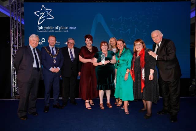 The ‘A Safe Space to be Me’ group accept their award from Co-operation Ireland Chairman Dr Christopher Moran and IPB Insurance Chairman George Jones. Also in the picture is Mayor of Antrim and Newtownabbey, Alderman Stephen Ross and Deputy Mayor of Antrim and Newtownabbey, Councillor Leah Smyth and RTE’s Marty Whelan (right).