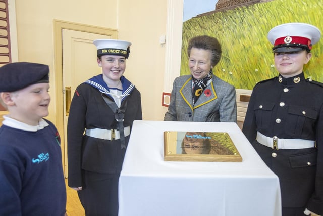 Princess Anne unveils a plaque to mark the 80th anniversary of the Sea Cadets Corps in Northern Ireland.