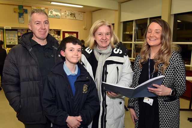 Miss Joy Lyness, RE teacher at Lurgan Junior High School discusses the curriculum with the Doherty family, dad Rory, mum Jill and prospective pupil Kai (11) during the school open night on Thursday. LM02-201.