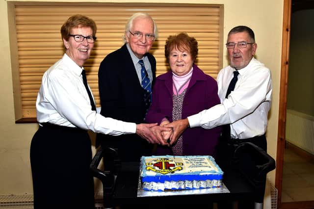 Cutting the anniversary cake at the 1st Charlemont and Cranagill BB 40th anniversary event are from left, Iris Jackson, Junior Section officer; Rev Brian Fletcher, former minister at Cranagill when the company was formed; Mrs Doreen Greenaway, wife of the late first company captain, and Bobby Dawson, current captain. PT03-223.