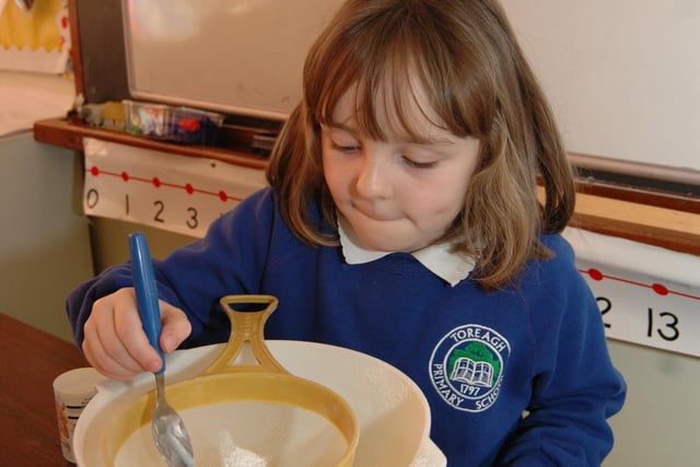 Joanne adds a spoonful of sugar to the pancake mixture at Toreagh P.S in 2007.