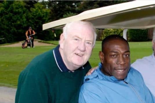 John Brown from Portadown with boxing champion Frank Bruno on the golf course.