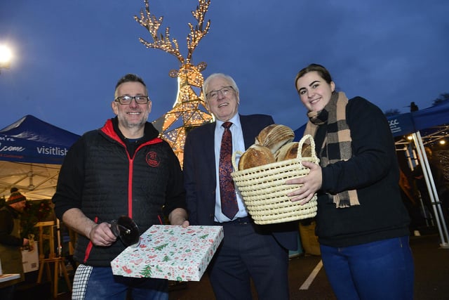 Darren McConnell, Pizza Table, Alderman Allan Ewart MBE, Chair of the Lisburn & Castlereagh City Council Development Committee and Amy McMullan, The Daily Apron at the Christmas Market in Dundonald