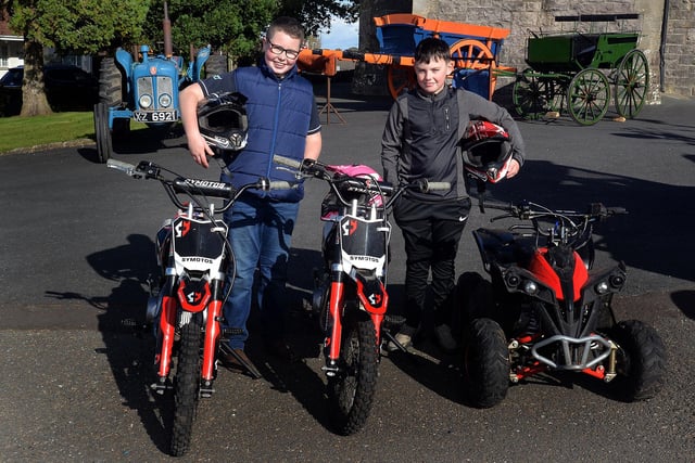 Showing off their pit bikes and quad which were on display at the Annaghmore Parish HarvestFest are Damel Jackson and James McCleary. PT42-216
