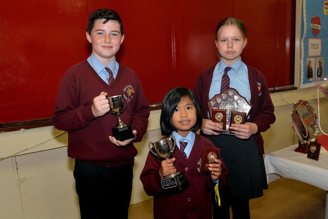 Ballyoran Primary School pupils pictured with their awards on prize day. Included are,from left, Mairtin Moylan, Numeracy award; Shekainah Buduan, Reading prize, and Goda Valiute, Star Pupil and Art and Design prizes. PT23-250. Photo by Tony Hendron