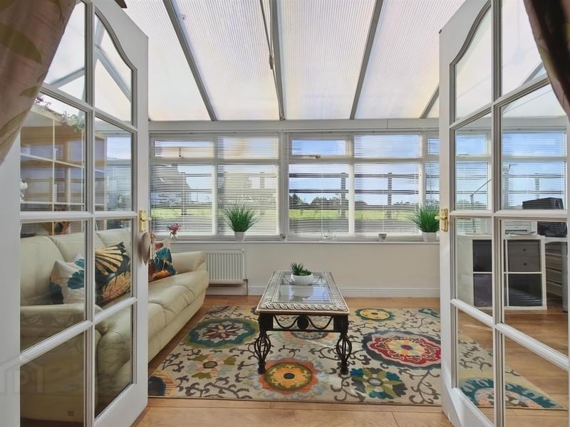 Conservatory with rural views to the rear.