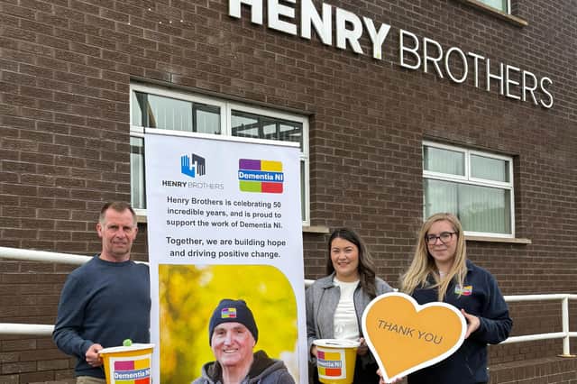 Ian Henry and Shannon McGilligan from Henry Brothers with Katrina Hughes, Donor Engagement Lead at Dementia NI, as the company announces the charity as its official partner for its 50th anniversary year. Credit: Supplied