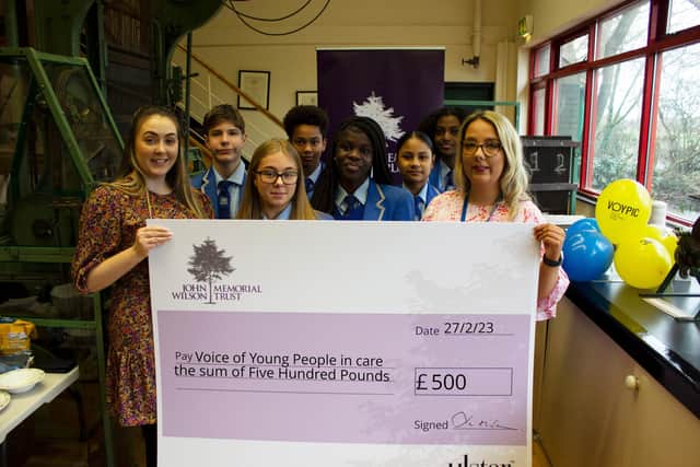 Staff and pupils from St John the Baptist’s College who were presented with a cheque for Voice of Young People in Care from The John Wilson Memorial Trust.