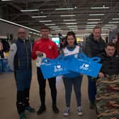 L to R- Adrian Daye, Sport Lisburn & Castlereagh Treasurer, athlete, Arnar Brynjarson, Nicole Moore, Sports Advisors at Decathlon Belfast, assisted runner, Aaron Kerr and Faron Morrison, Sports Development Officer for Lisburn & Castlereagh City Council