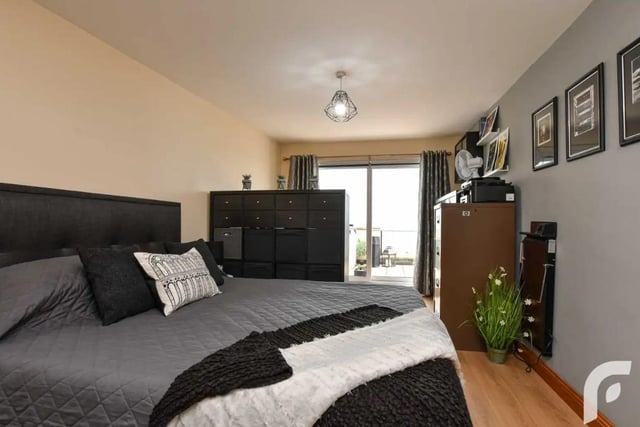 Large double bedroom with access to roof terrace.