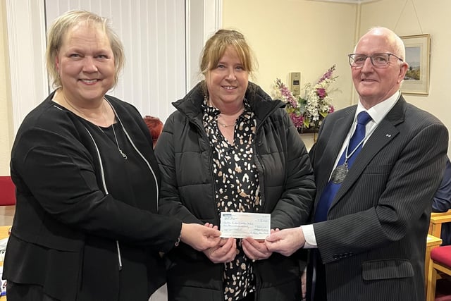 Chairman of the Lisburn and District Masonic Charity Fund, Eddie Carson presented a cheque to representatives from Knitted Knockers.