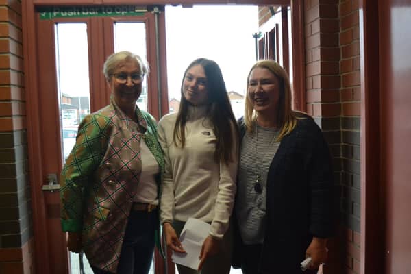 Laurelhill Head Girl Autumn Murdough is congratulated by Mrs Beckett and Mrs Stewart on excellent A Level results. Autumn moves on to study Digital and Screen Acting at LIPA. Pic credit: Laurelhill Community College