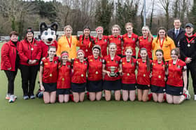 Banbridge Academy's successful U14 team pictured with principal Robin McLoughlin and their coaches with the trophy.