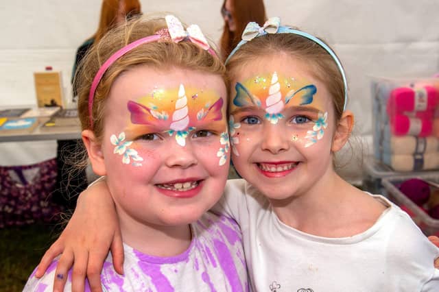 Showing off their painted faces at the Drumcree Parish Garden Fete are, Maisie Johnston (7), left, and Faith Davison (6). PT23-234.