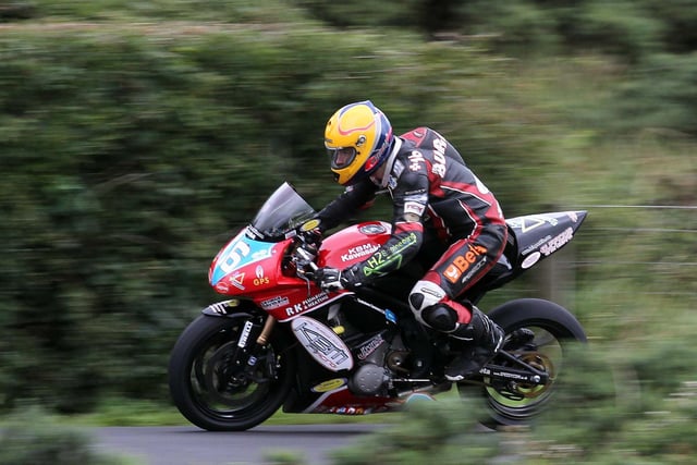John Burrows in action on race day around the Armoy Circuit on his supertwin in 2010