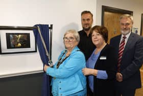 Mayor of Mid and East Antrim Beth Adger unveils the McKeefry Unit plaque, along with Dorothy, Health