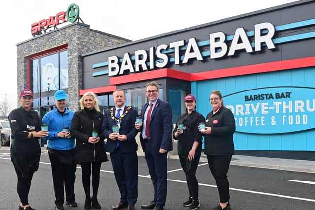 Ald Stephen Ross with John Clarke, Henderson Retail regional manager, Sharon Kane, Henderson Retail area manager, Leanne Kelly, Post Office manager and staff members Monika Jablonskiene, Francesca Rowan and Naomi Marno.