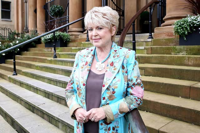 Mary Winifred Gloria Hunniford, OBE was born 10 April 1940 in Portadown. Her father was a musician and encouraged her to sing on stage when she was a child. She began her career in radio and TV here in NI. She is known for presenting programmes on the BBC and ITV, such as Rip Off Britain, and her regular appearances as a panellist on Loose Women. She has been a regular reporter on This Morning and The One Show. She also had a singing career between the 1960s and 1980s. She also took part in the Masked Singer and Strictly Come Dancing.  She was married to Don Keating from 1970 to 1992. They had a daughter, Caron Keating, and two sons, Paul and Michael. In September 1998, she married hairdresser Stephen Way in Tunbridge Wells, Kent. her daughter died of breast cancer in Kent. Later Gloria set up a cancer charity in her daughter's name; the Caron Keating Foundation. She was appointed Officer of the Order of the British Empire (OBE) in the 2017 Birthday Honours for services to cancer charities.