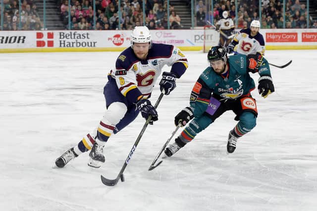 Belfast Giants’ Mark Garside with Guildford Flames' Kyle Locke during Saturday night’s Elite Ice Hockey League game at the SSE Arena, Belfast. Photo by William Cherry/Presseye