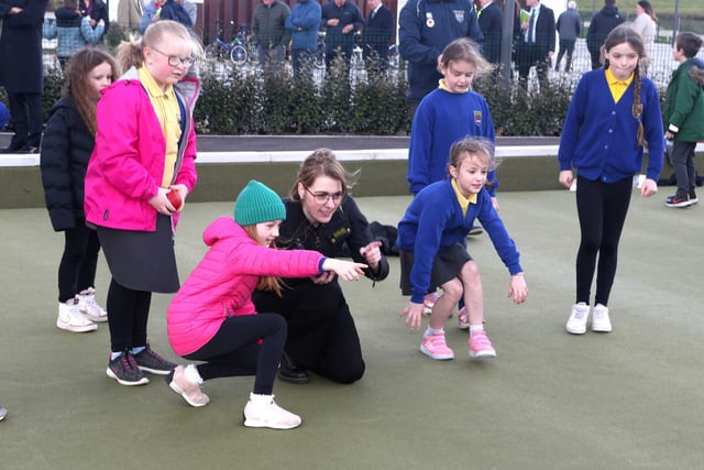 Dehenna Davison, Parliamentary Under-Secretary of State for the Department for Levelling Up, Housing and Communities enjoying her time in Portrush with pupils from Portrush Primary School.