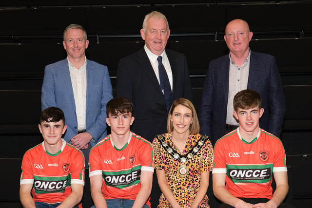 Pictured at the Civic Awards are representatives of the Lavey Under 17’s Hurling team, the inaugural winners of the Under Seventeen Táin Óg Division One Championship in 2022.  Also pictured are Council Chair, Councillor Corry and nominating Councillor, Councillor S McPeake.
