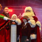 Anna and Nancy Nicolls from Loanends Primary School helping the Mayor of Antrim and Newtownabbey, Councillor Mark Cooper switch on the Crumlin lights with Santa and Buddy the Elf!