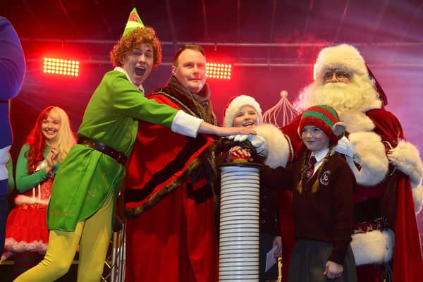 Anna and Nancy Nicolls from Loanends Primary School helping the Mayor of Antrim and Newtownabbey, Councillor Mark Cooper switch on the Crumlin lights with Santa and Buddy the Elf!