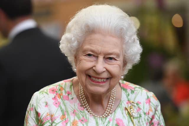ST AUSTELL, ENGLAND - JUNE 11: Queen Elizabeth II attends an event in celebration of The Big Lunch initiative at The Eden Project during the G7 Summit on June 11, 2021 in St Austell, Cornwall, England. UK Prime Minister, Boris Johnson, hosts leaders from the USA, Japan, Germany, France, Italy and Canada at the G7 Summit. This year the UK has invited India, South Africa, and South Korea to attend the Leaders' Summit as guest countries as well as the EU. (Photo by Oli Scarff - WPA Pool / Getty Images)