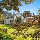 A charming early 18th-century property filled with character, Wayside Cottage retains a wealth of period features while incorporating the comforts expected of a modern home. The ground floor includes a welcoming living room, open-plan sitting and dining area, sun room, and fitted integrated kitchen. Upstairs are three bedrooms and a family bathroom. Oil-fired central heating and double glazing further enhance the property.  There's also plenty outdoors for the equestrian enthusiast, with four loose boxes accompanied by a feed room, club room, forage and machinery stores, and a lorry shed, along with a 100m x 40m all-weather arena and adjoining paddock.  This lovely home is on the market for offers around £550,000 with Templeton Robinson.