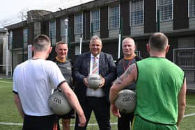 Maghaberry Prison has teamed up with Ulster GAA to coach skills for Gaelic football to prisoners as part of a sports rehabilitation initiative. Maghaberry Governor David Savage (centre) is pictured with Ulster GAA coaches Roger Keenan and Tony Scullion. Picture: Michael Cooper