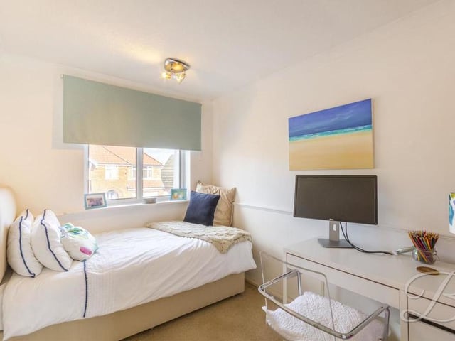 This tastefully decorated bedroom might be compact, but there is still room for a desk if you need to do some work from home.