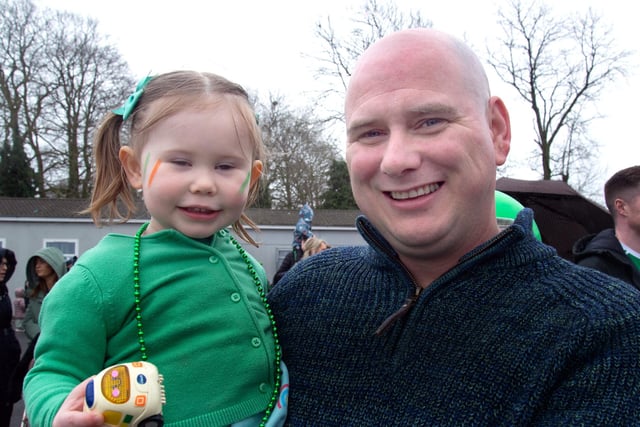 Enjoying the fun at the  Derrymacash St Patrick's Day parade are Chloe Toland (2) and dad, Dwain. LM12-235.