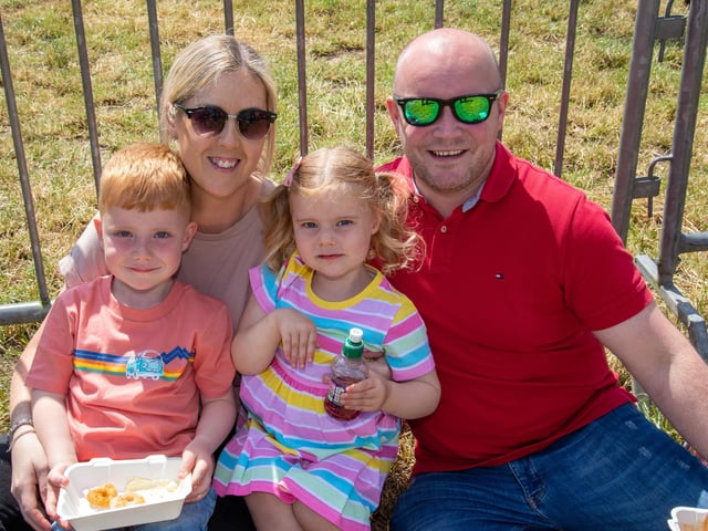 Taking a well earned break from the fun at the Drumcree Parish Garden Fete are the Fleck family. Included are, Kayden (4), mum, Louise, Freya (3) and dad, Chris. PT23-233.