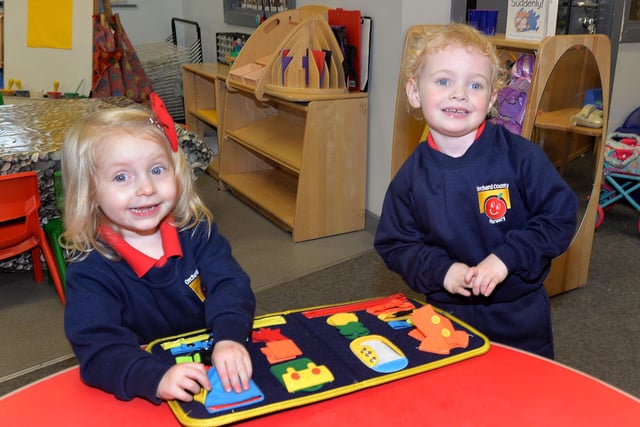 Enjoying themselves at Orchard County Primary School Nursery Unit are friends Mollie and Darcie-Mae. PT41-326.