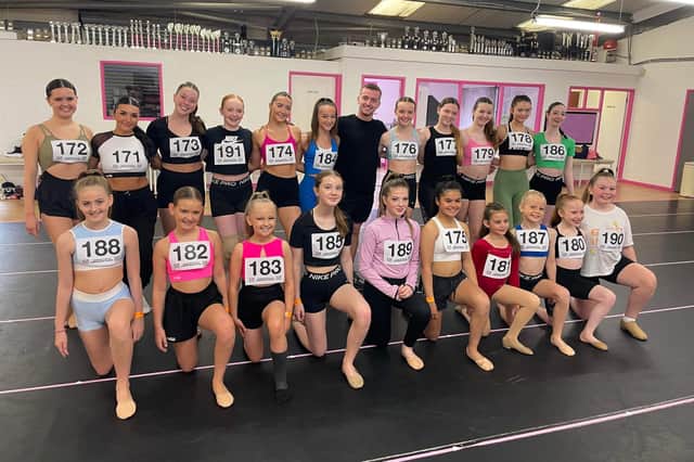 Sean Taaffe, Can You Dance? (CYD?) is pictured with Paige Kerr (back row, third from left) and other dancers. Credit Fiona Brown Communications